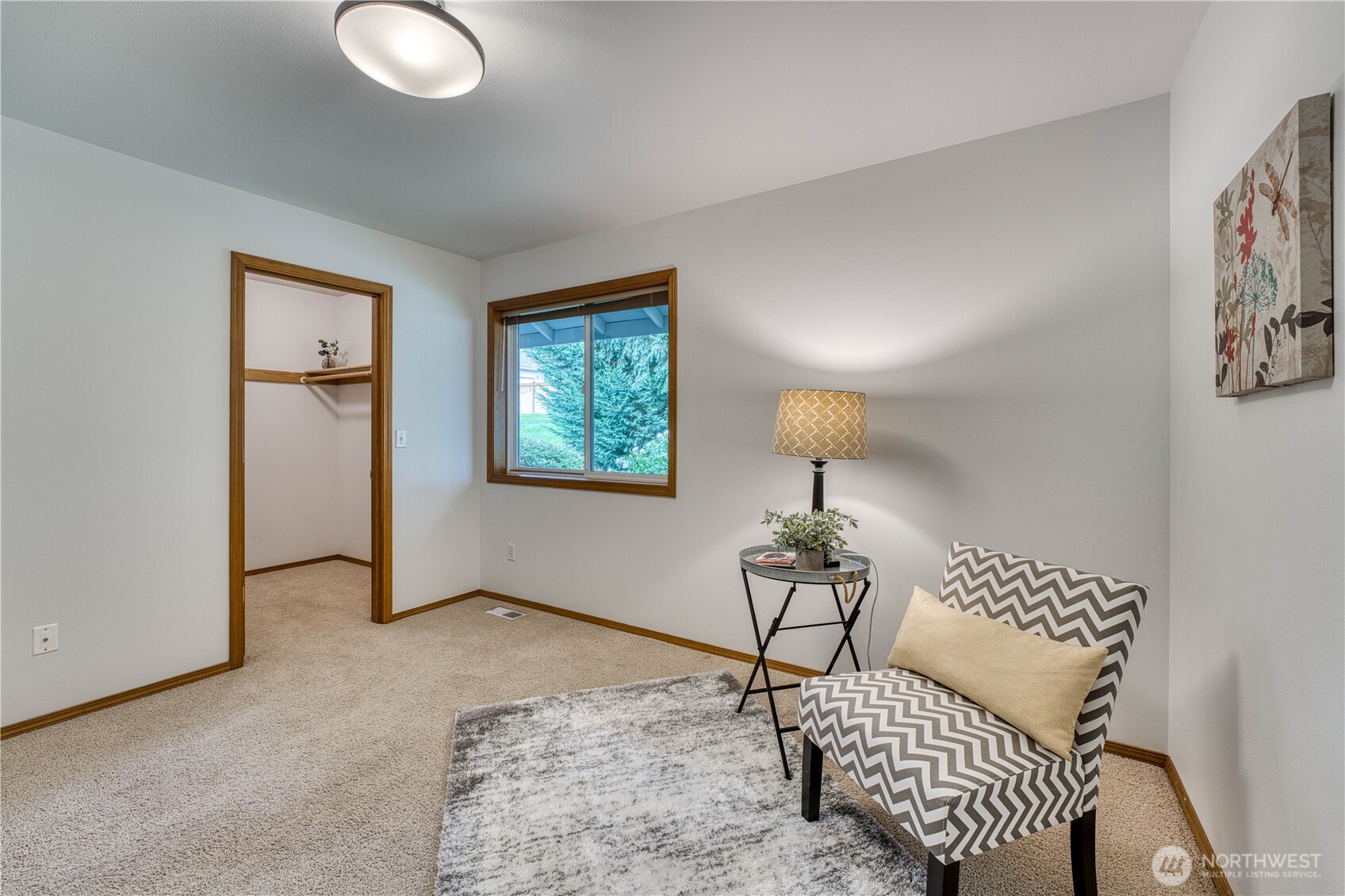 5203 53rd Street West University Place, WA 98467 - Photo 25 of 33 a living room with a couch and a chandelier