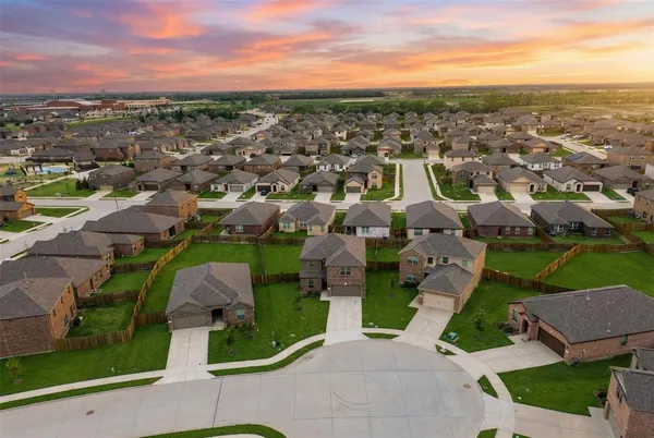 an aerial view of a houses with a lake view