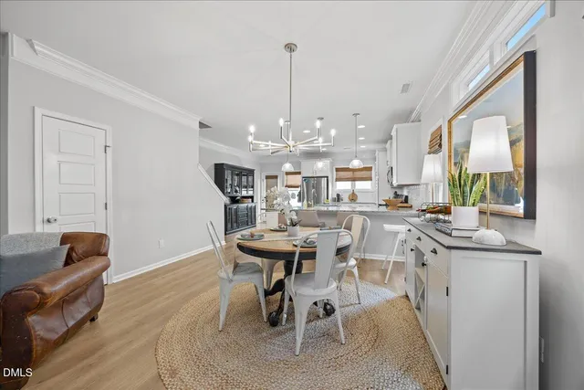 a living room with furniture a fireplace and a ceiling fan