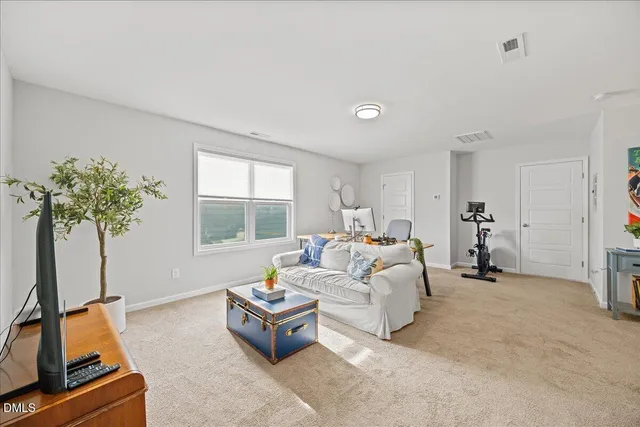 a bedroom with two beds and a window