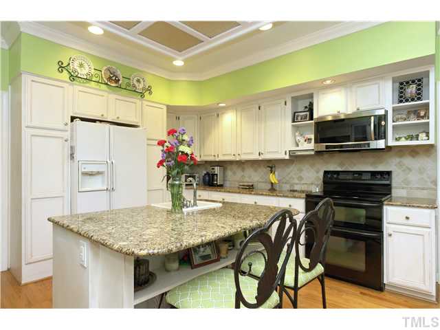 2104 Countrywood Road North Raleigh, NC 27615 - Photo 14 of 25 a kitchen with a table and chairs in it