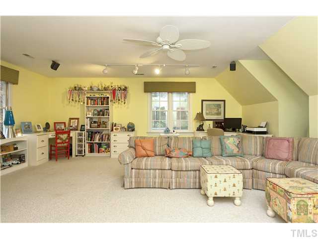 2104 Countrywood Road North Raleigh, NC 27615 - Photo 22 of 25 a living room with furniture and view of kitchen