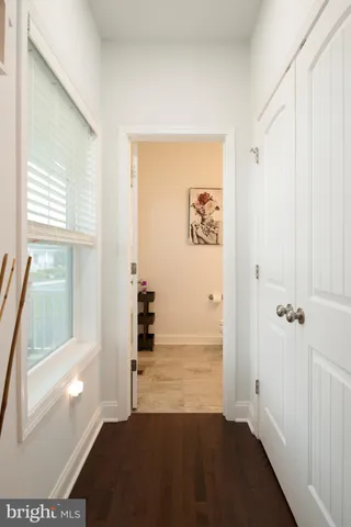 a bathroom with a sink toilet and a mirror
