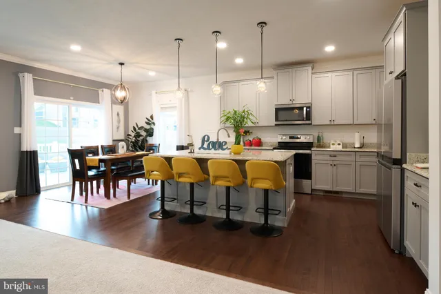 a view of kitchen with cabinets and wooden floor