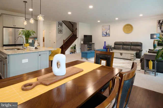 a view of staircase with wooden floor and a potted plant