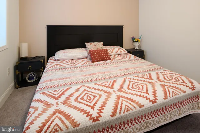 a bathroom with a double vanity sink toilet and a mirror
