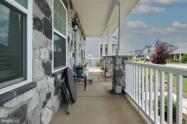 a front view of a building with glass windows and door