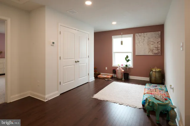 a spacious bedroom with a bed and window