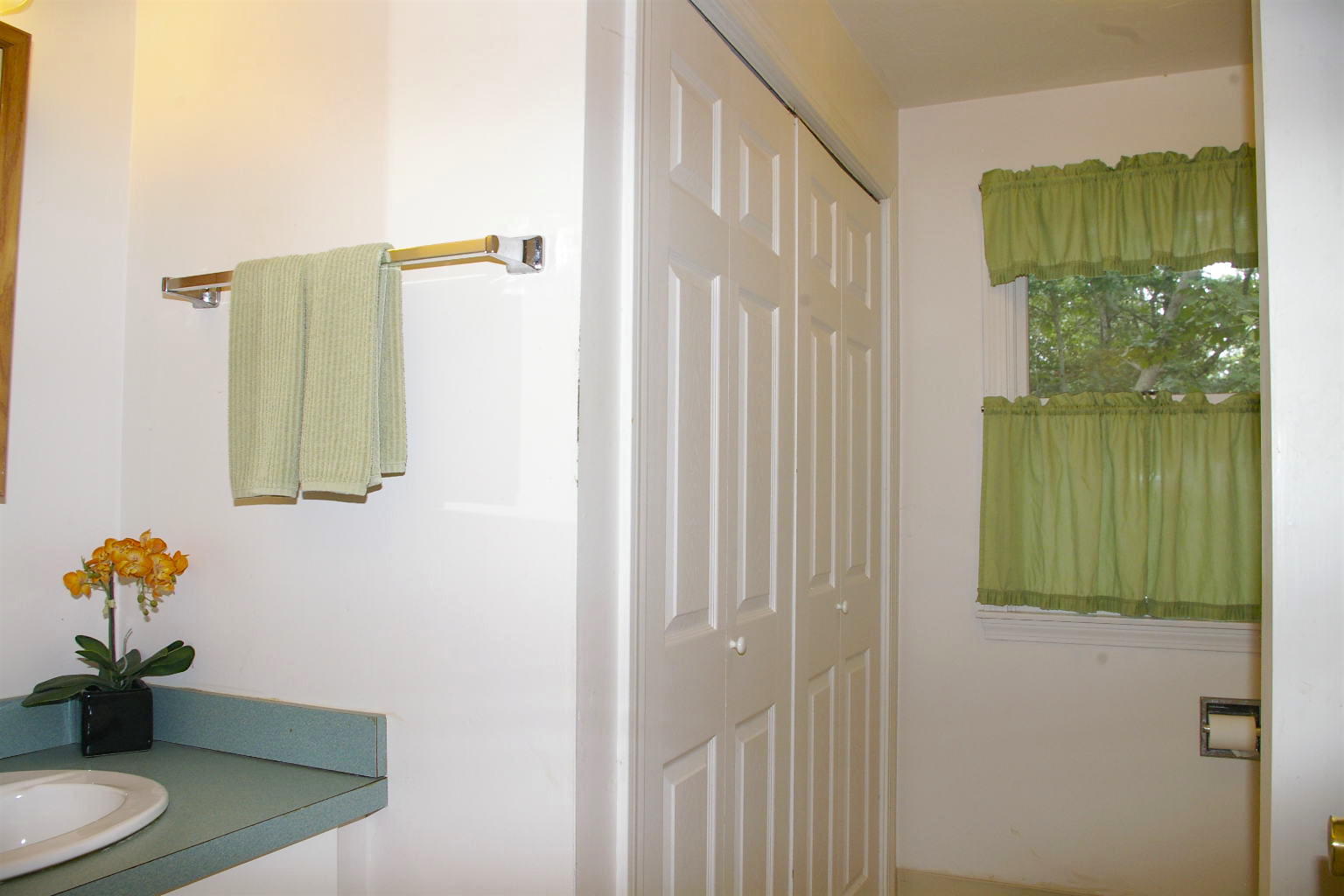10 Juniper Way Eastham, MA 02642 - Photo 12 of 31 a bathroom with a sink mirror and vanity