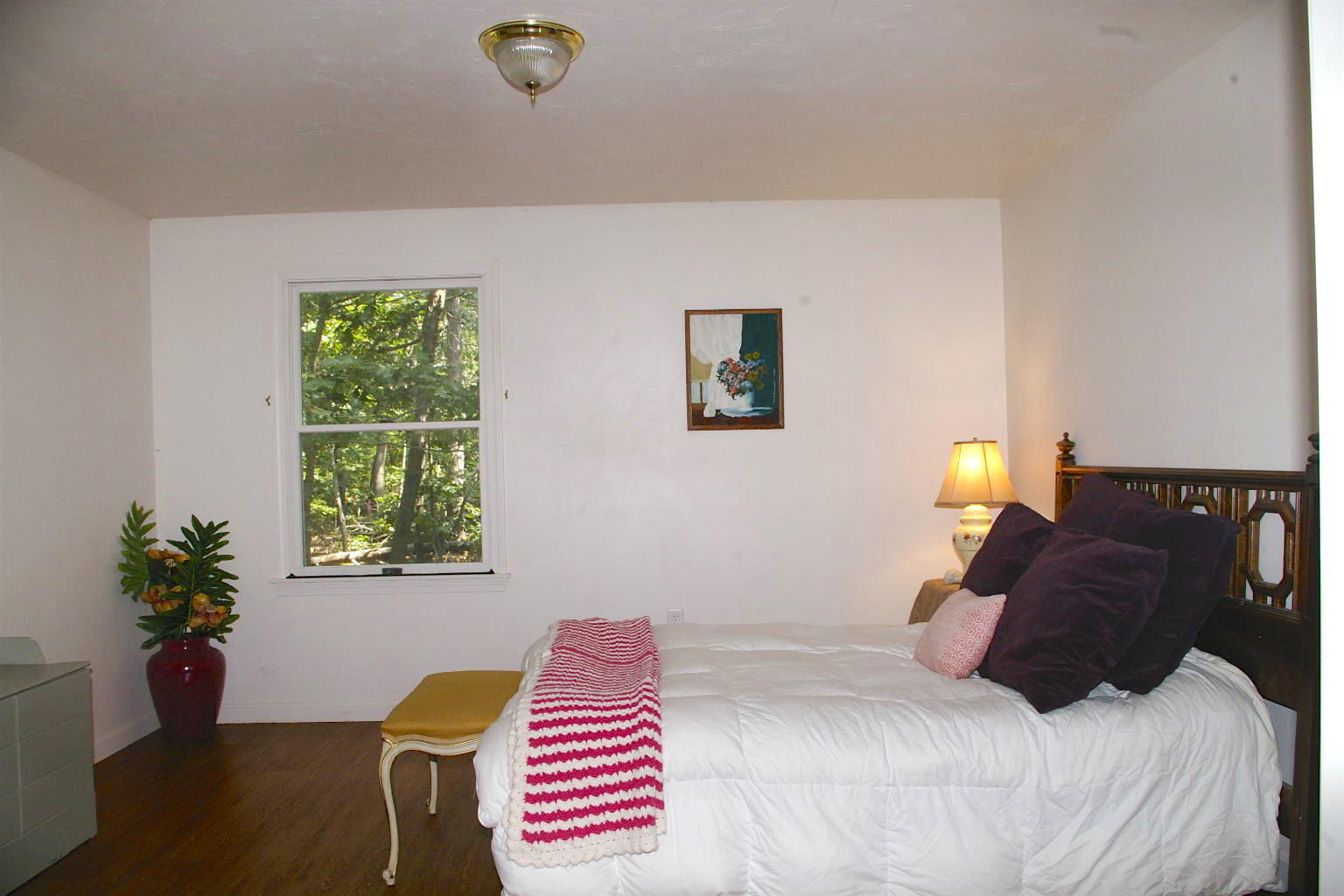 10 Juniper Way Eastham, MA 02642 - Photo 19 of 31 a bedroom with a bed and a window