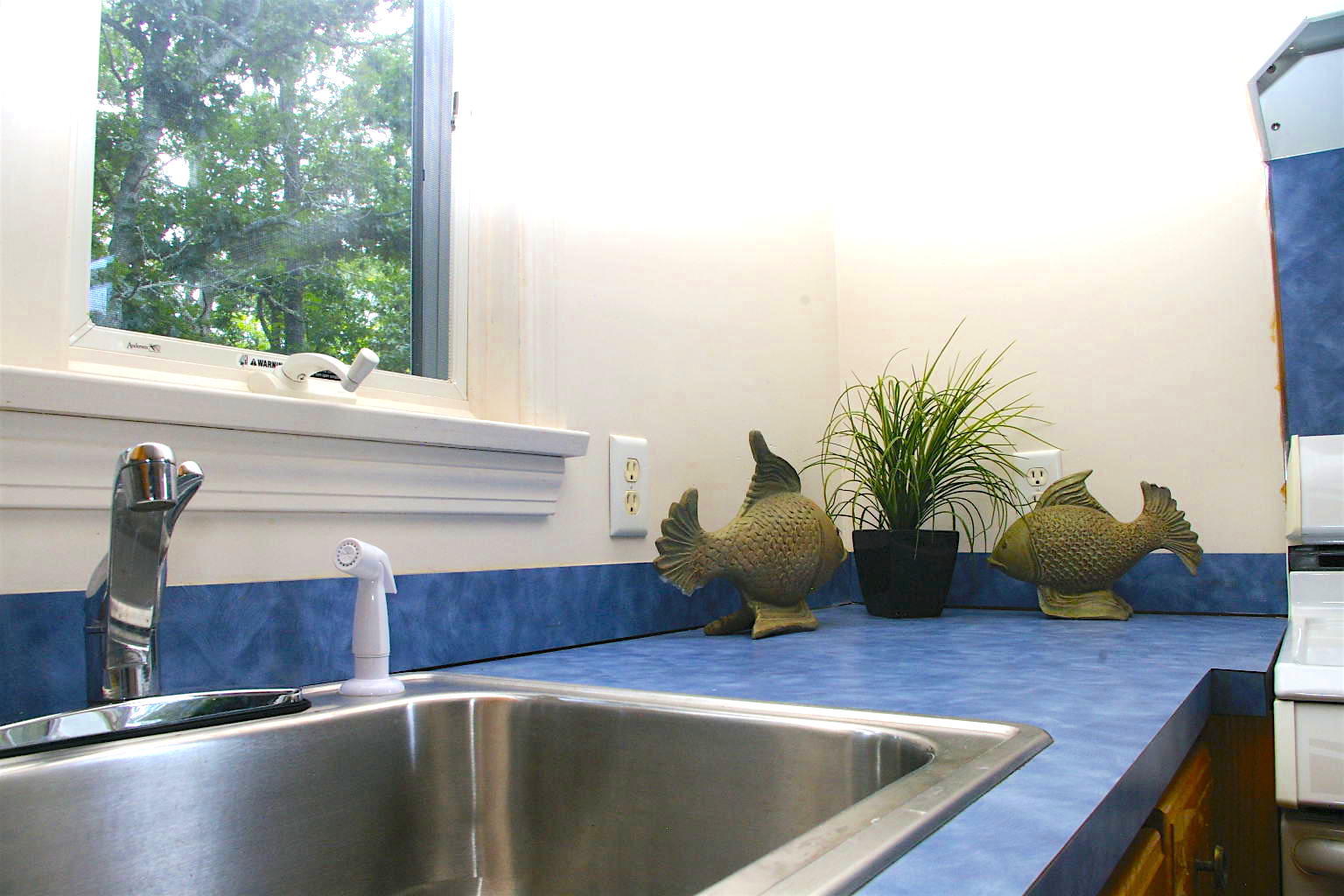 10 Juniper Way Eastham, MA 02642 - Photo 7 of 31 a kitchen with a sink and a window