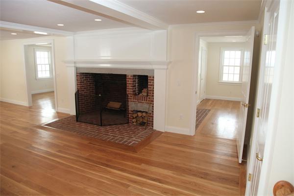 486 Greenwich Road Hardwick, MA 01037 - Photo 21 of 30 an empty room with wooden floor and a fireplace