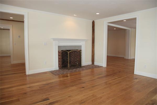 486 Greenwich Road Hardwick, MA 01037 - Photo 22 of 30 an empty room with wooden floor and fireplace