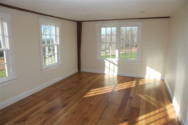 486 Greenwich Road Hardwick, MA 01037 - Photo 24 of 30 an empty room with wooden floor and windows