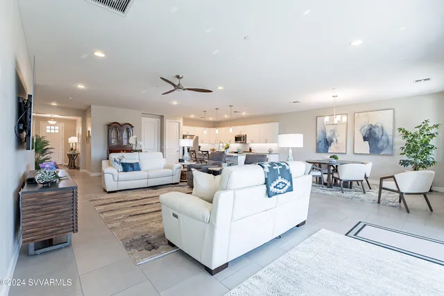 a kitchen with stainless steel appliances granite countertop white cabinets a sink and dishwasher