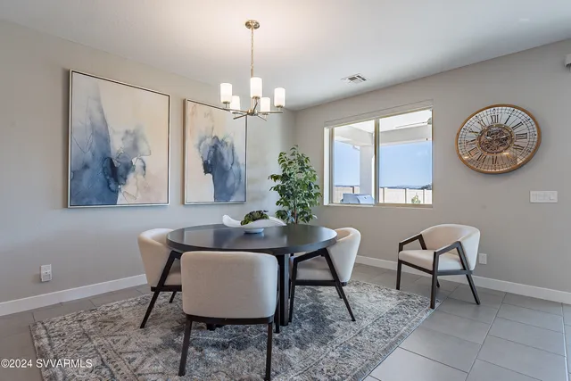 a spacious bedroom with a bed and wooden floor