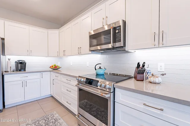 a bedroom with a bed a lamp and window