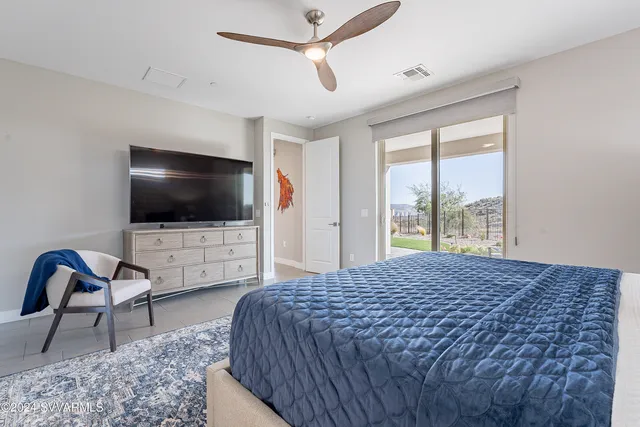 a bedroom with a bed and dresser