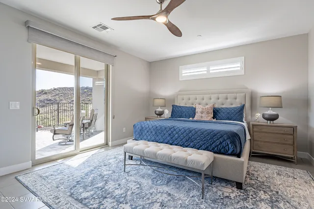 a bedroom with a large bed and furniture