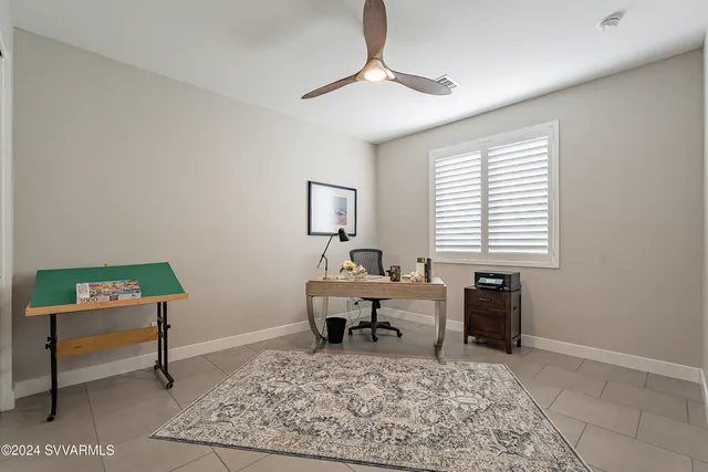 a view of a house with backyard swimming pool and sitting area