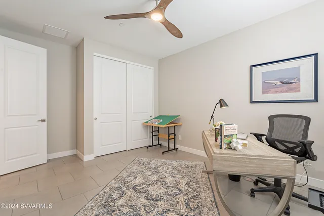 a view of a house with swimming pool and sitting area