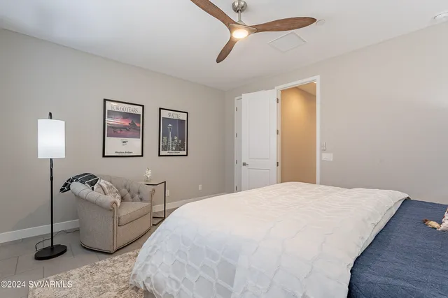 a view of a porch with chairs and backyard