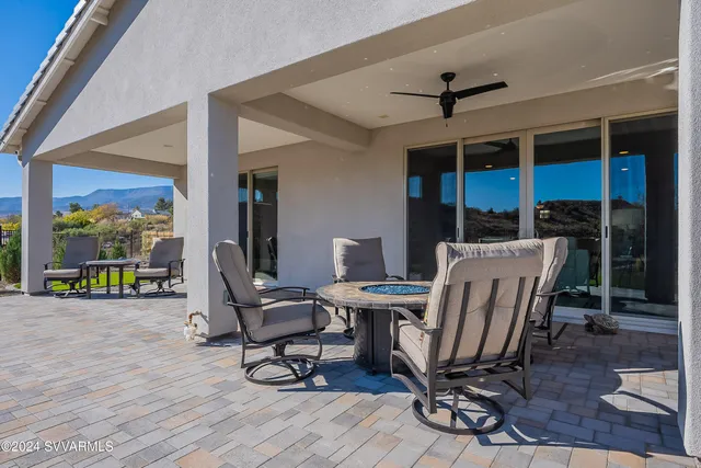 an aerial view of a house with a mountain
