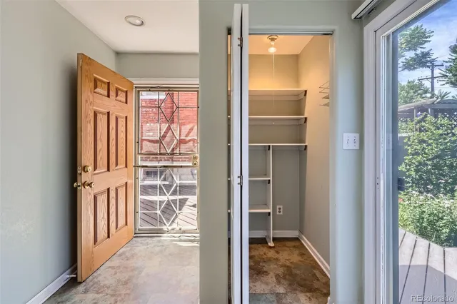 a view of a table and chairs in patio of the house