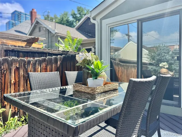 a view of a bedroom with wooden floor and stairs
