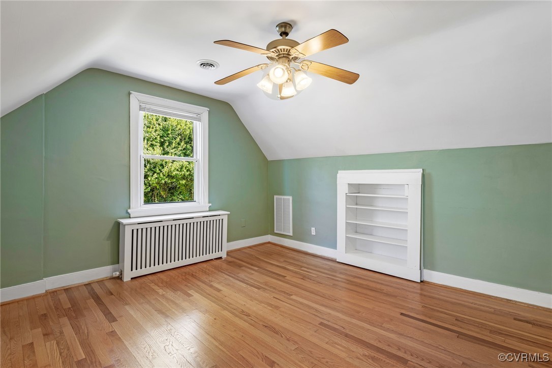 1109 Skipwith Road Henrico, VA 23229 - Photo 11 of 33 an empty room with wooden floor fan and windows