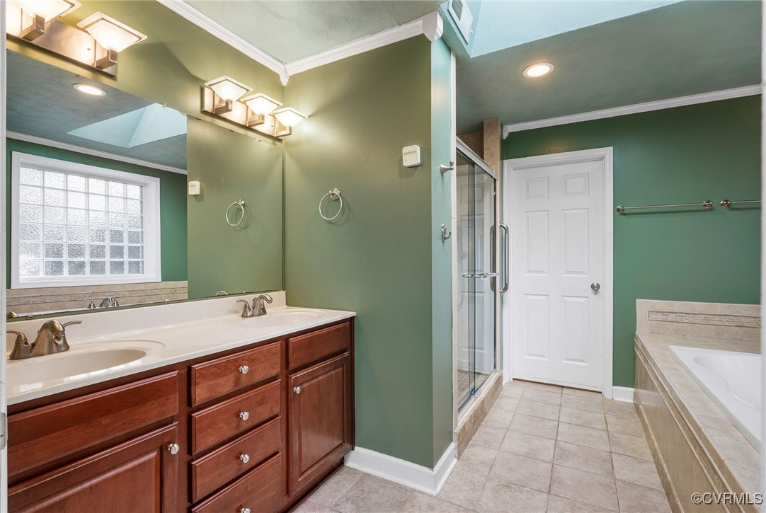 1109 Skipwith Road Henrico, VA 23229 - Photo 20 of 33 a spacious bathroom with a double vanity sink mirror and a bathtub
