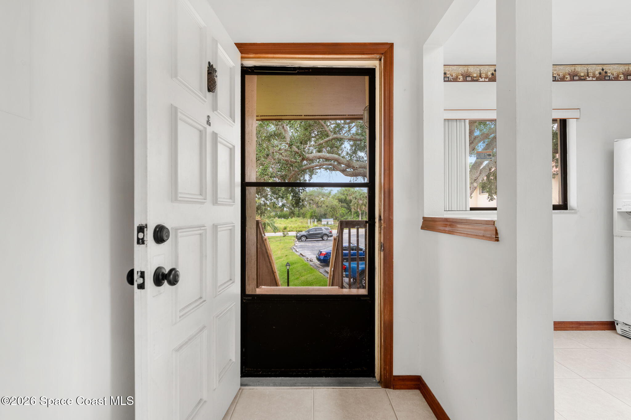 3121 Kirkland Road Northeast Palm Bay, FL 32905 - Photo 6 of 52 hallway with wooden floor and windows