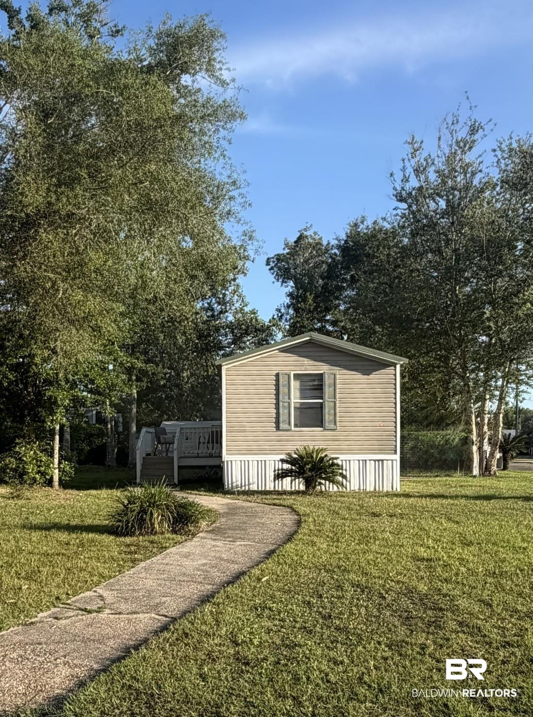 1125 Ridgewood Drive Lillian, AL 36549 - Photo 16 of 36 Single-story residence featuring horizontal siding and a skirted foundation