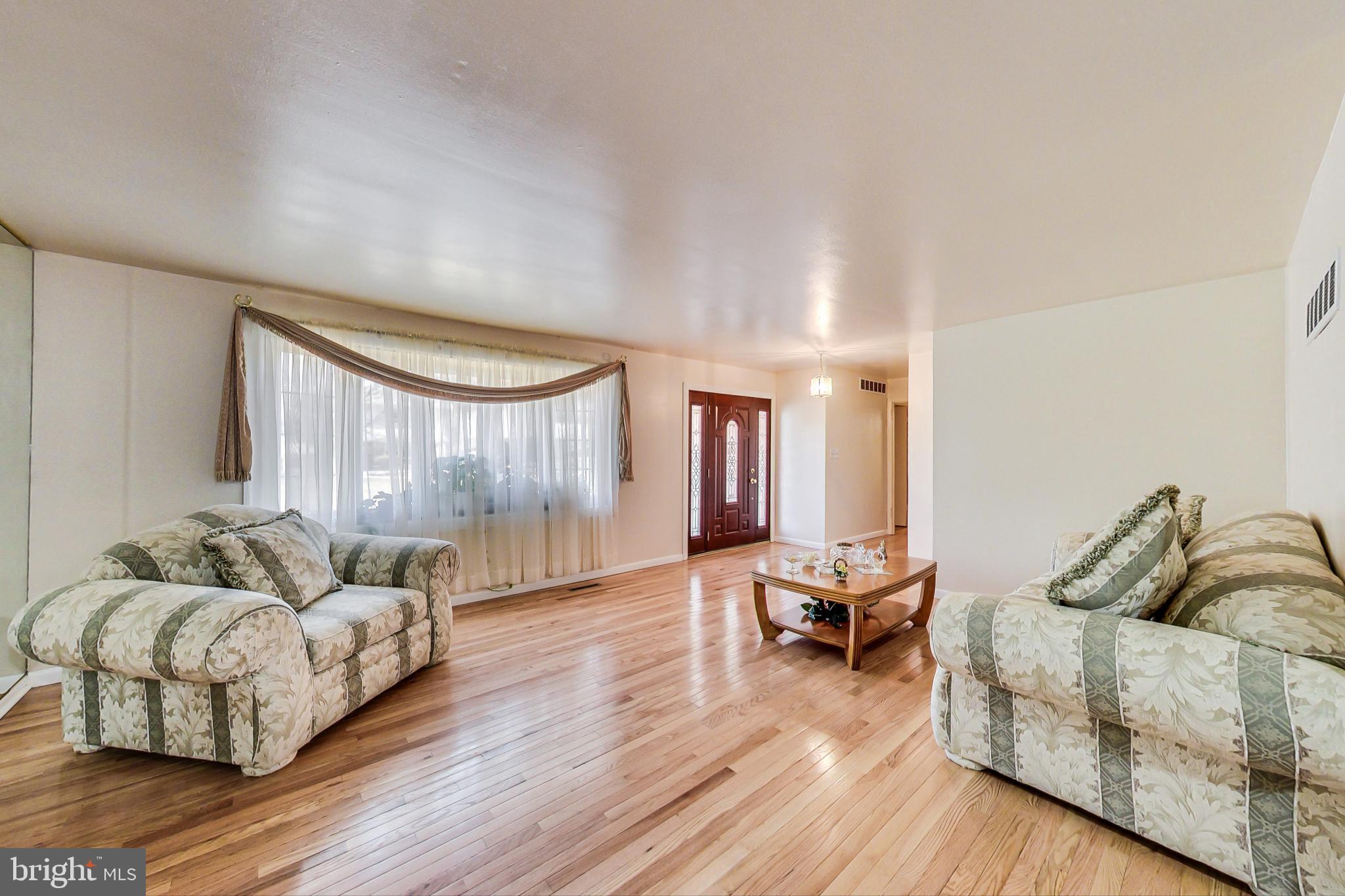 4525 Hawksbury Road Baltimore, MD 21208 - Photo 3 of 53 Huge living room with hardwood floors