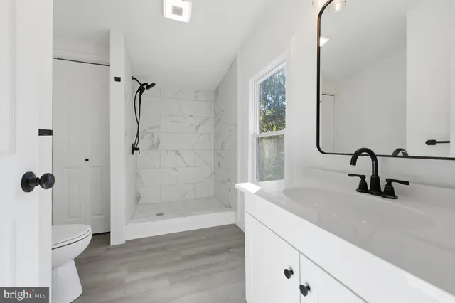 a bathroom with a sink and mirror