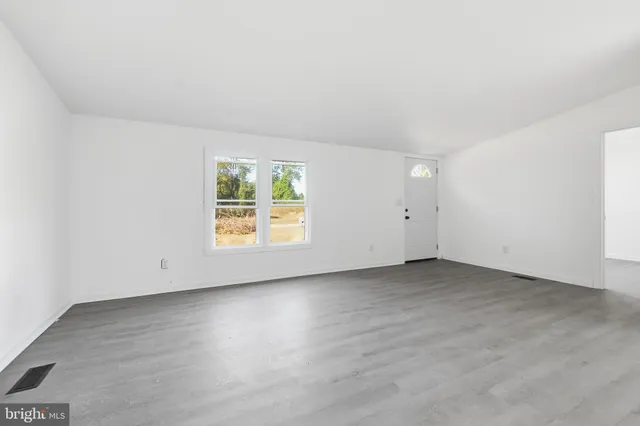 an empty room with windows