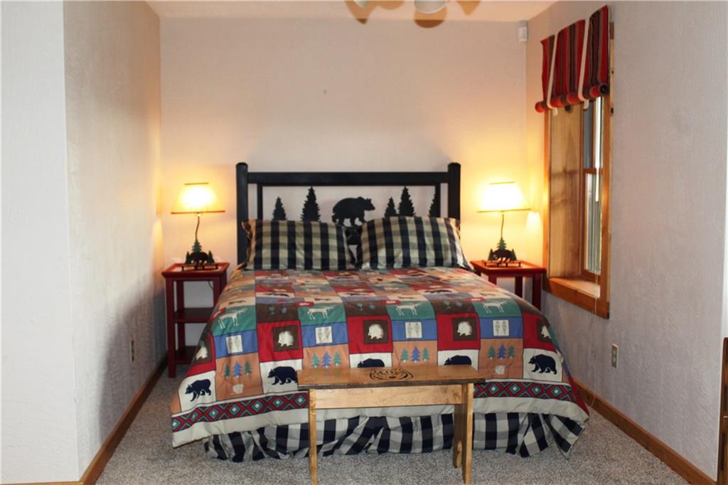 793 Fire Tower Road Champion, PA 15622 - Photo 22 of 25 This room has a queen bed, a double bed and a single bed. The bathroom is out the door and off of the game room.