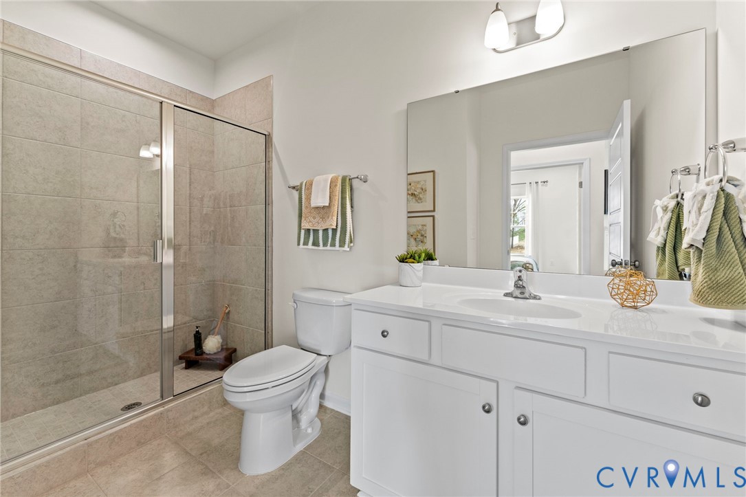 5300 Qualla Trace Chesterfield, VA 23832 - Photo 14 of 38 a bathroom with a toilet a sink and shower
