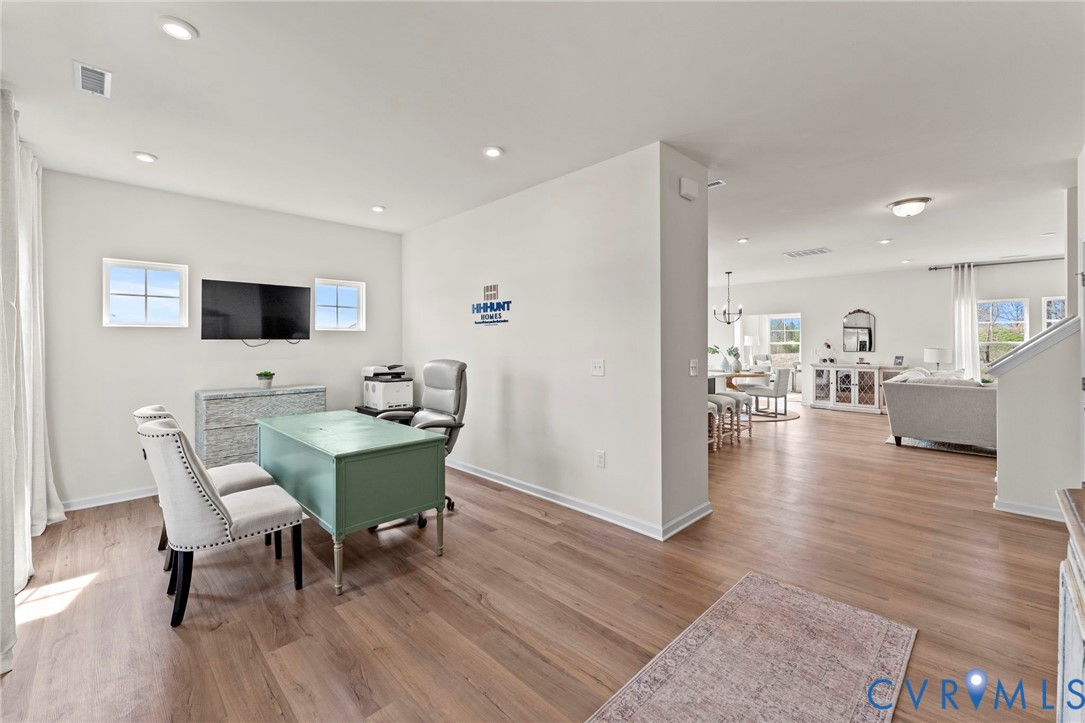 5300 Qualla Trace Chesterfield, VA 23832 - Photo 2 of 38 a view of a dining room with furniture and wooden floor