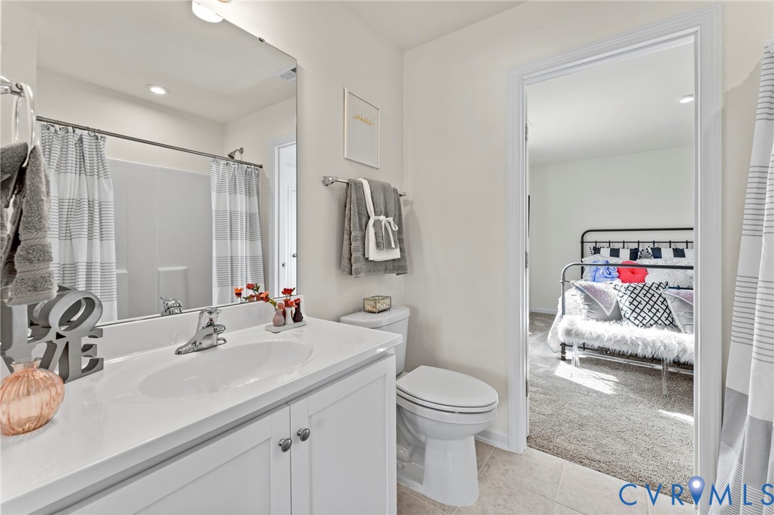 5300 Qualla Trace Chesterfield, VA 23832 - Photo 23 of 38 a bathroom with a sink vanity mirror and toilet
