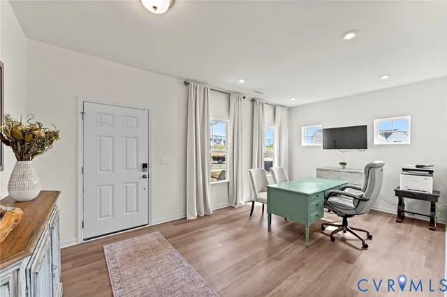 a workspace with furniture and wooden floor