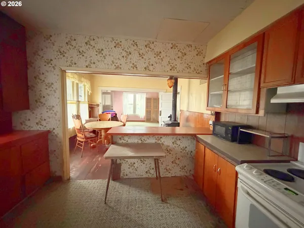 a kitchen with stainless steel appliances granite countertop sink stove and granite counter top