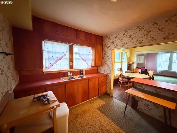 a room with furniture pool table and windows