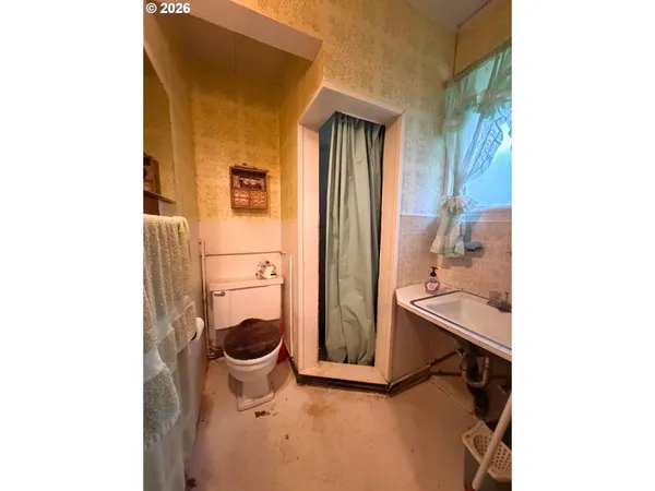 a bathroom with a toilet and a sink