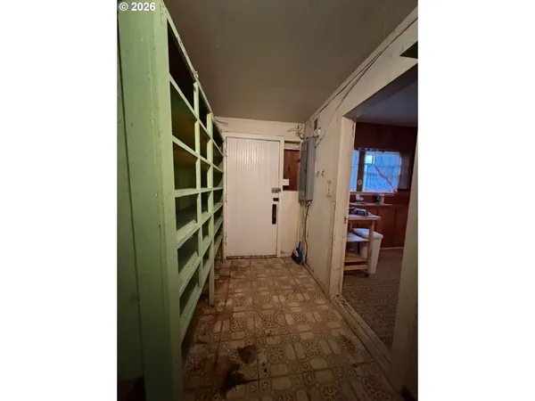 a view of walk in closet with clothes