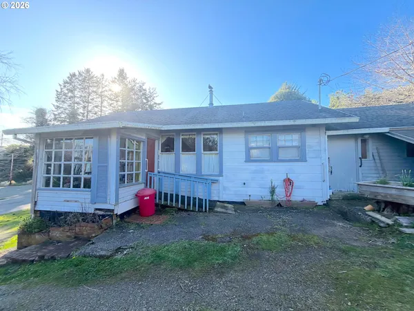 a front view of a house with yard