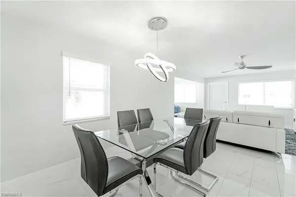 a dining room with furniture and window