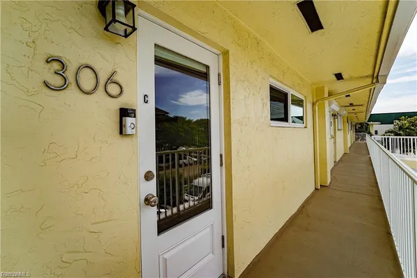 a hallway with a door and a door