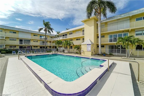 a view of a swimming pool with a patio