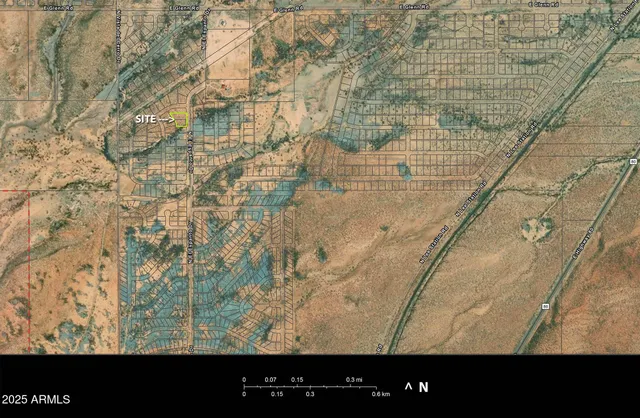 a view of a yard with wooden fence